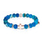 St. Lily of the Mohawks | Rose Gold Cross | Blue Striped Agate Bracelet